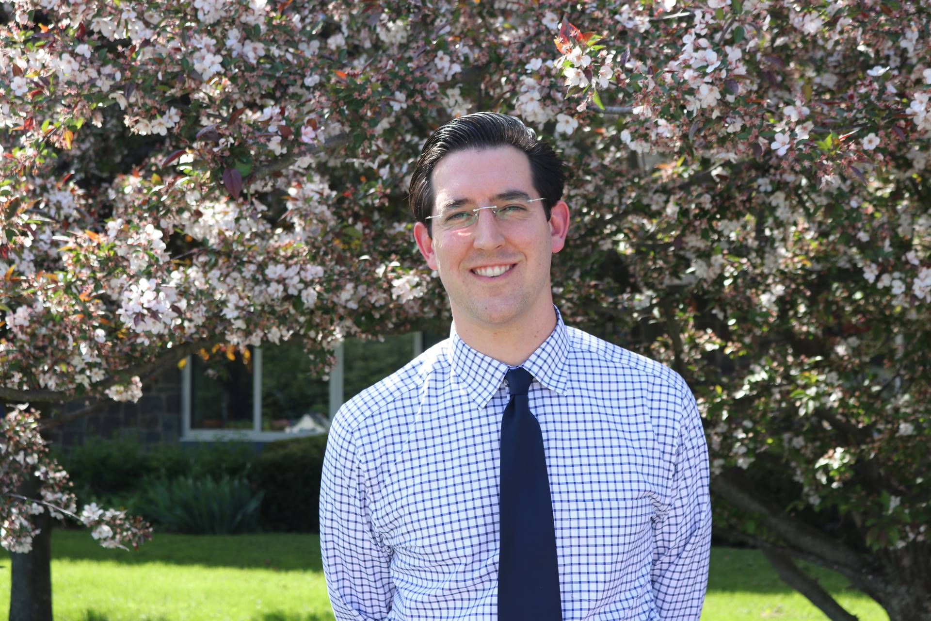 Picture of primary school principal in front of trees