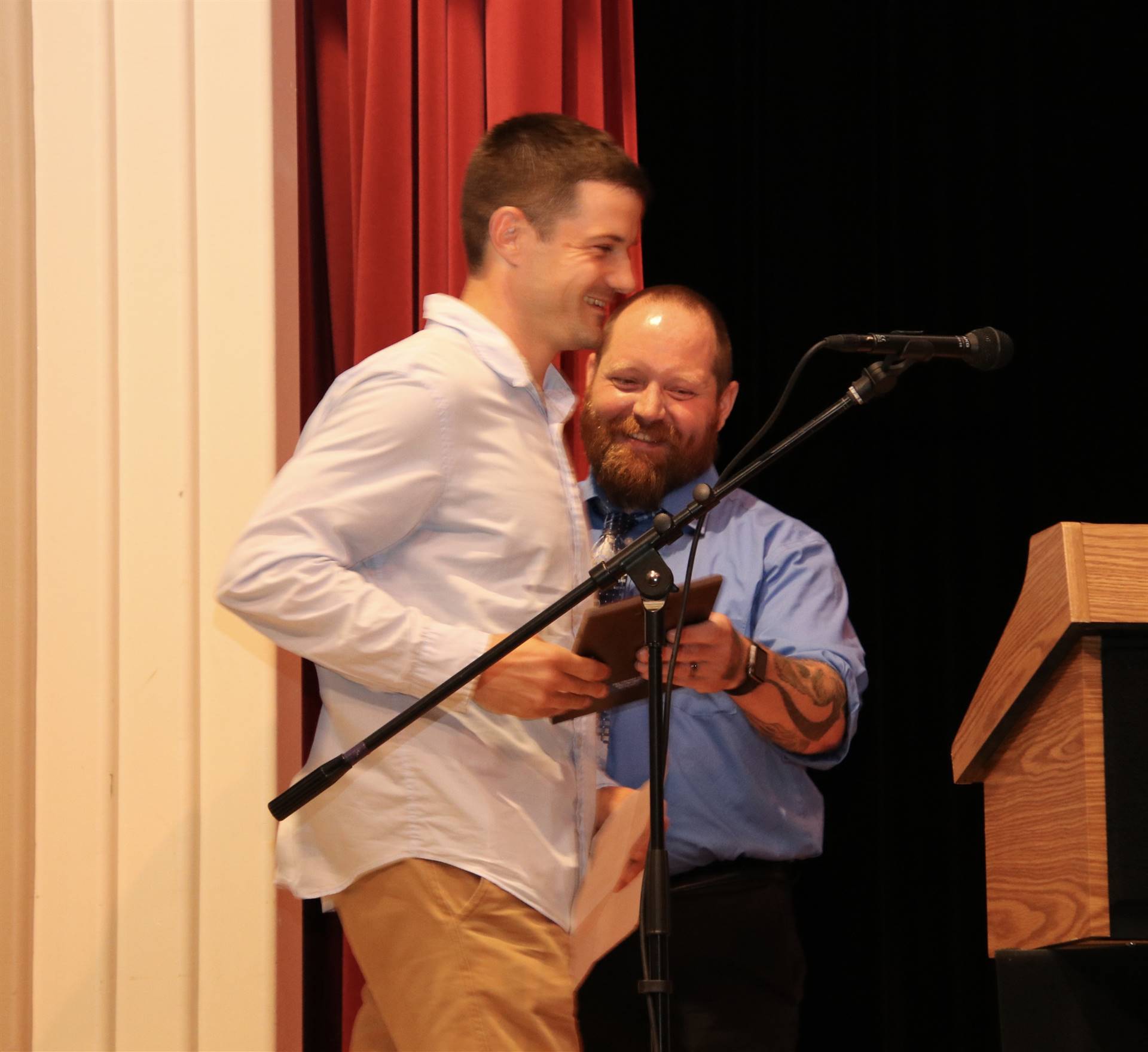 Award being handed to Mr. Korver on stage