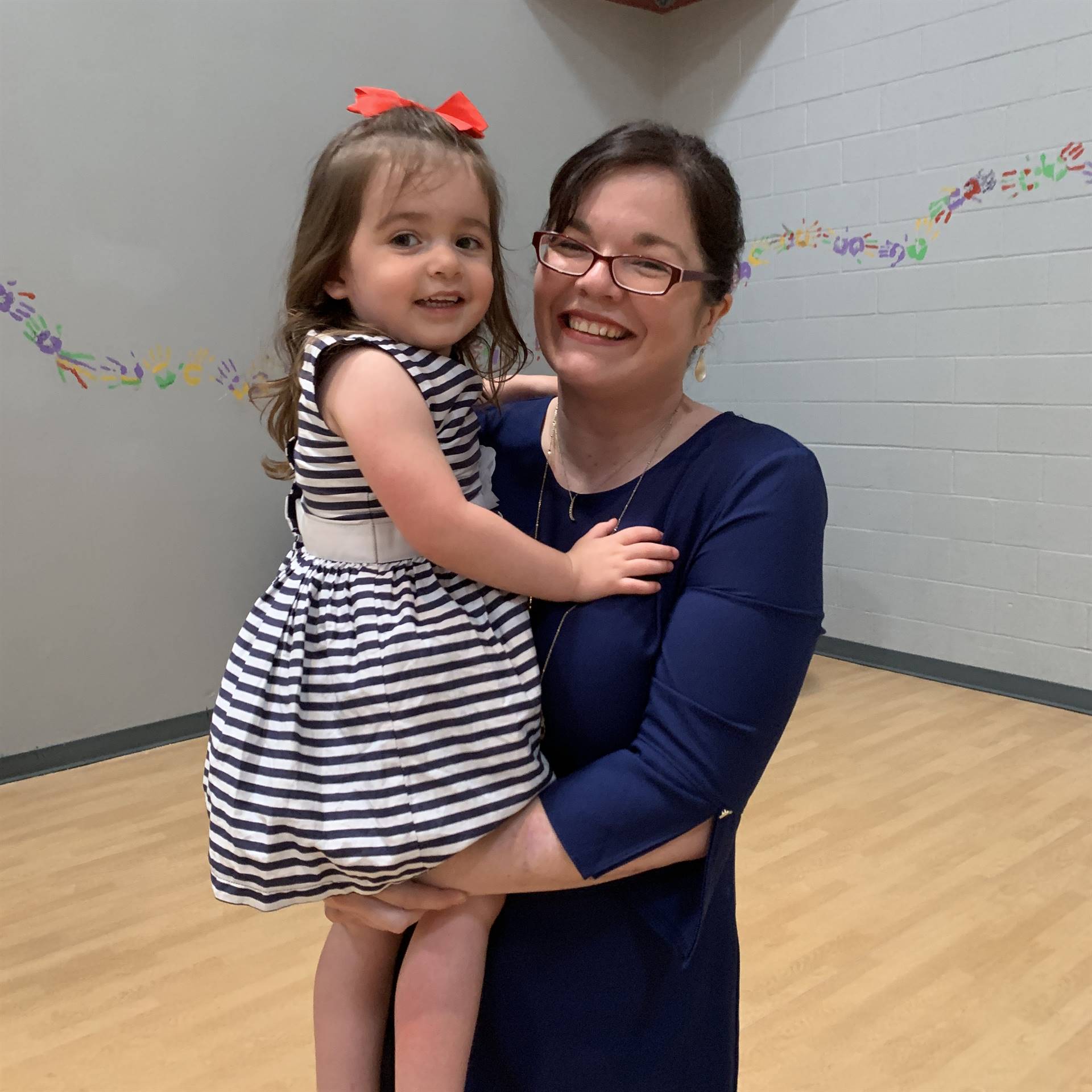 Dr. O'Reilly and holding her daughter