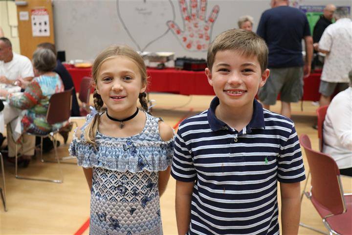 Son and daughter of honoree