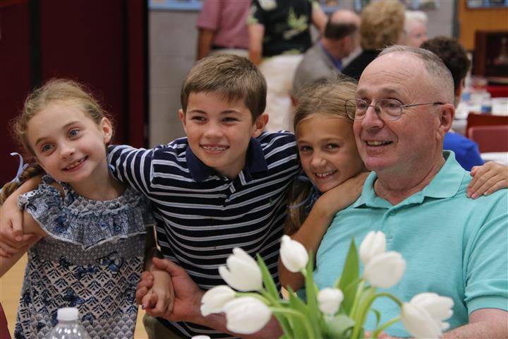 attendees posing with family members