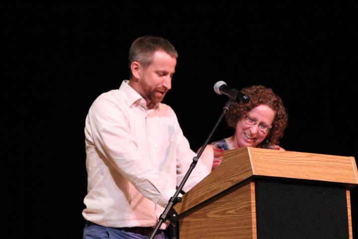 honoree&#39;s adult kids at podium