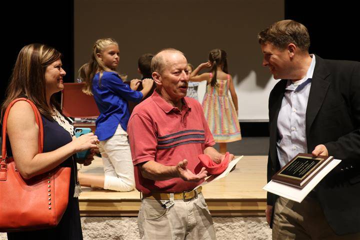 Honoree and teacher talking