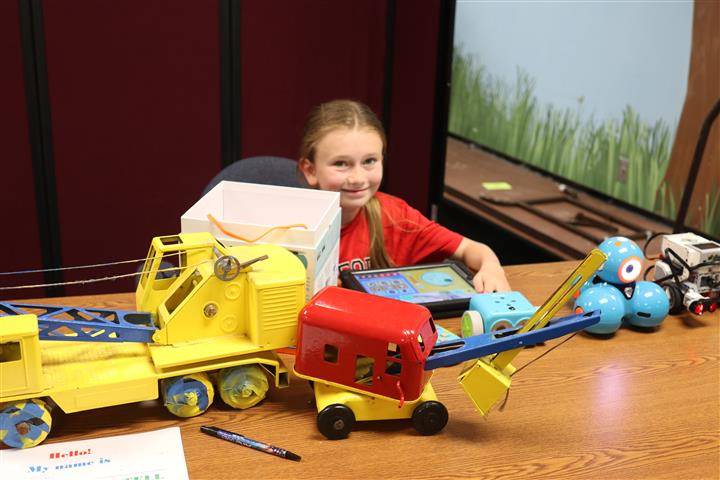 Robot display with construction trucks