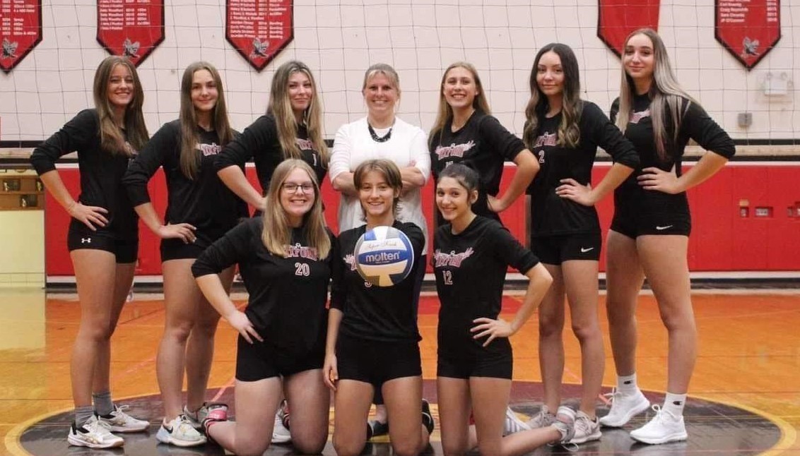 Volleyball team with coach