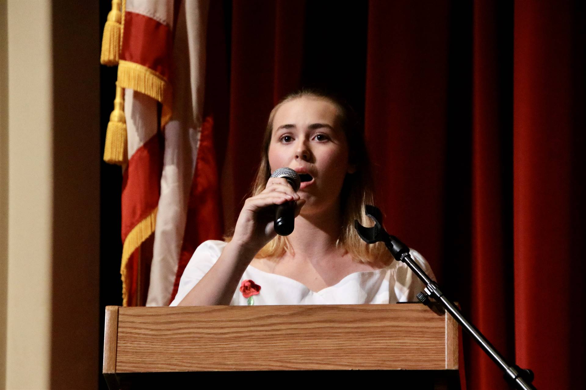 Student singing for Hall of Distinction ceremony