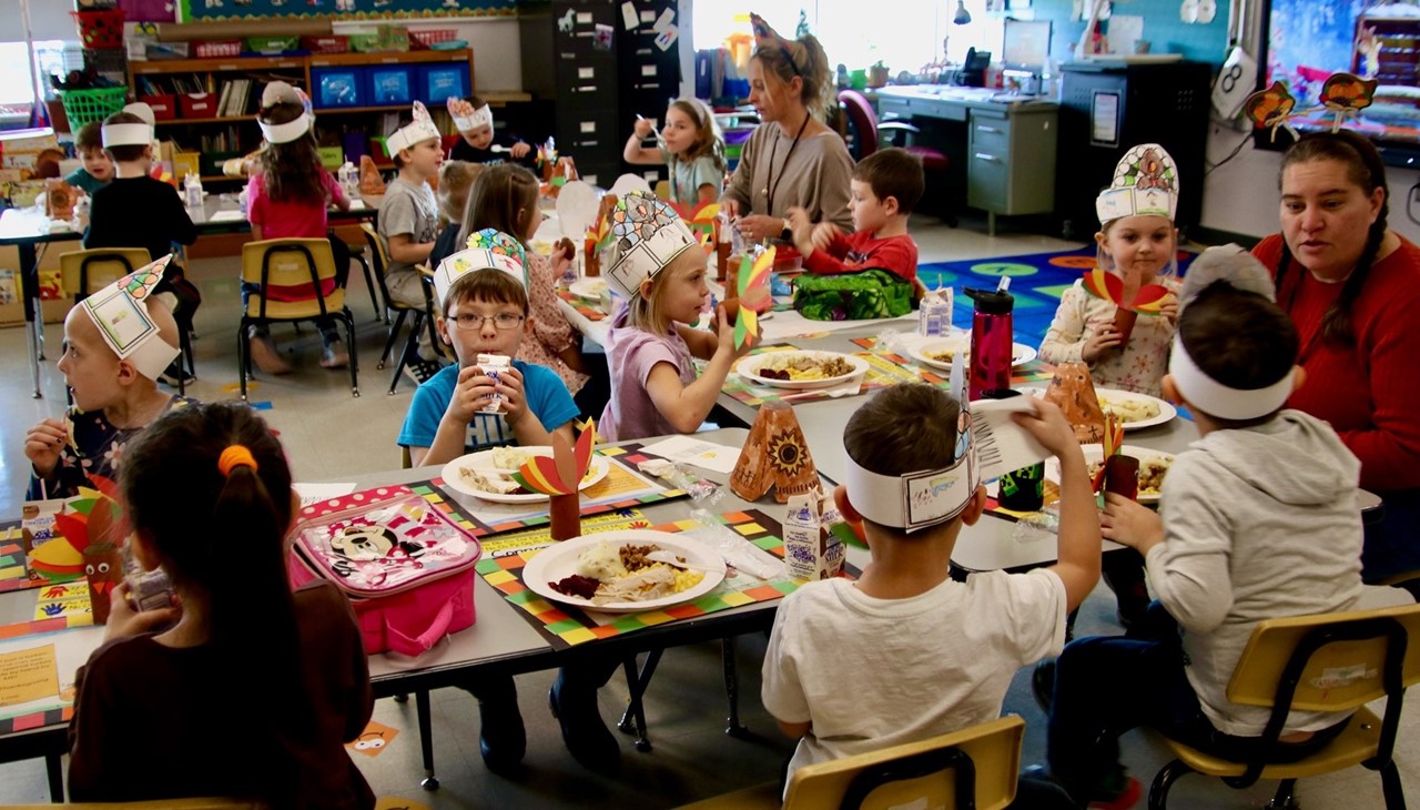 Classroom Thanksgiving feast - students eating