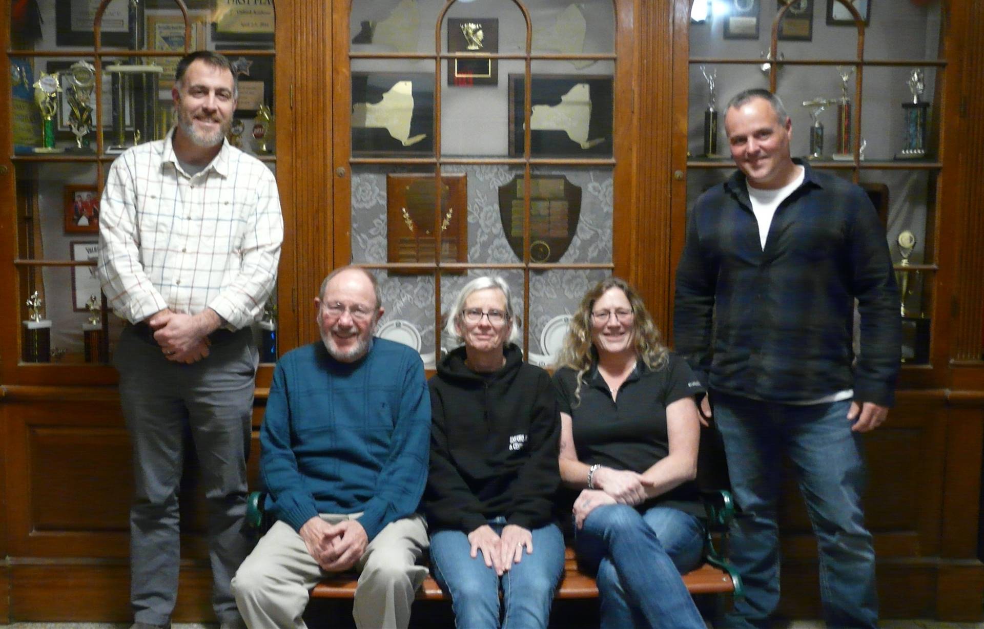 BOE members - some sitting on bench and some standing