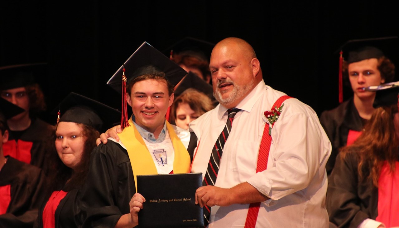 Graduate receiving his diploma