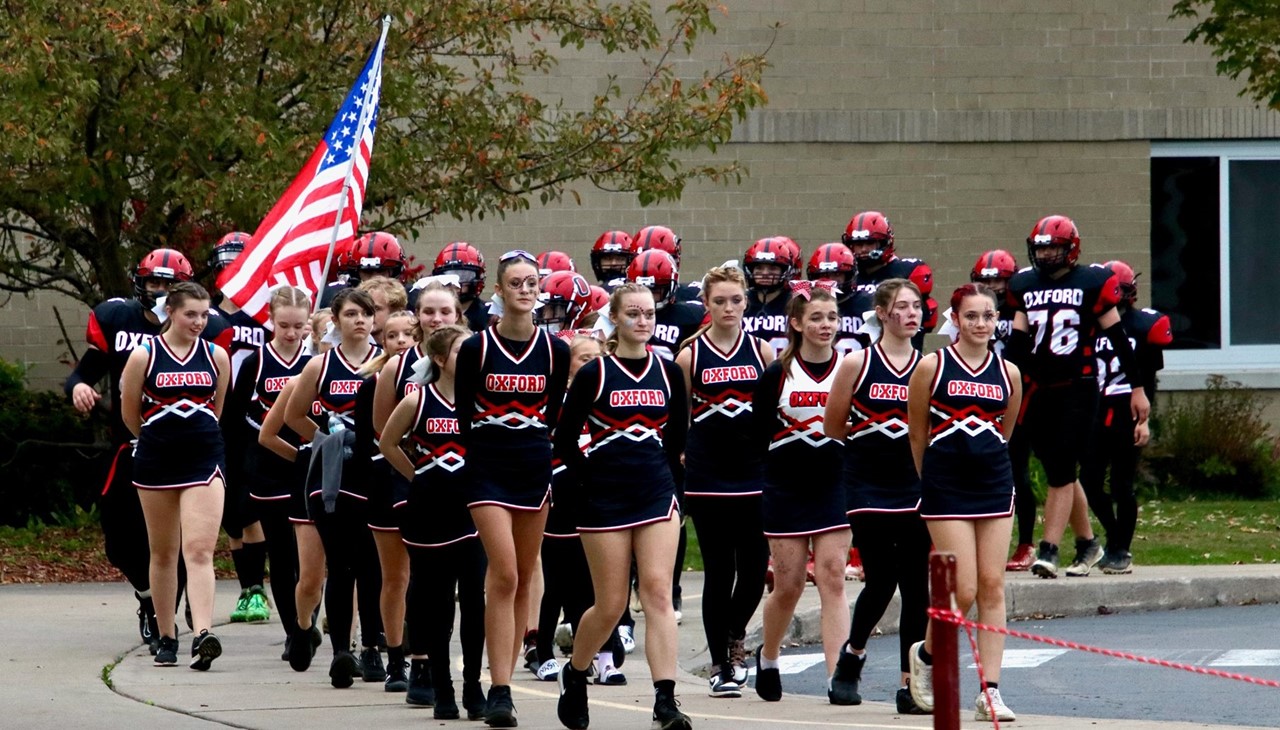 Cheerleaders in a group marching