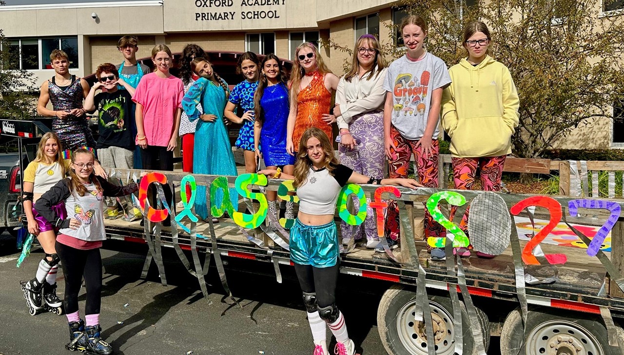 Homecoming parade - rollerskaters and disco attire