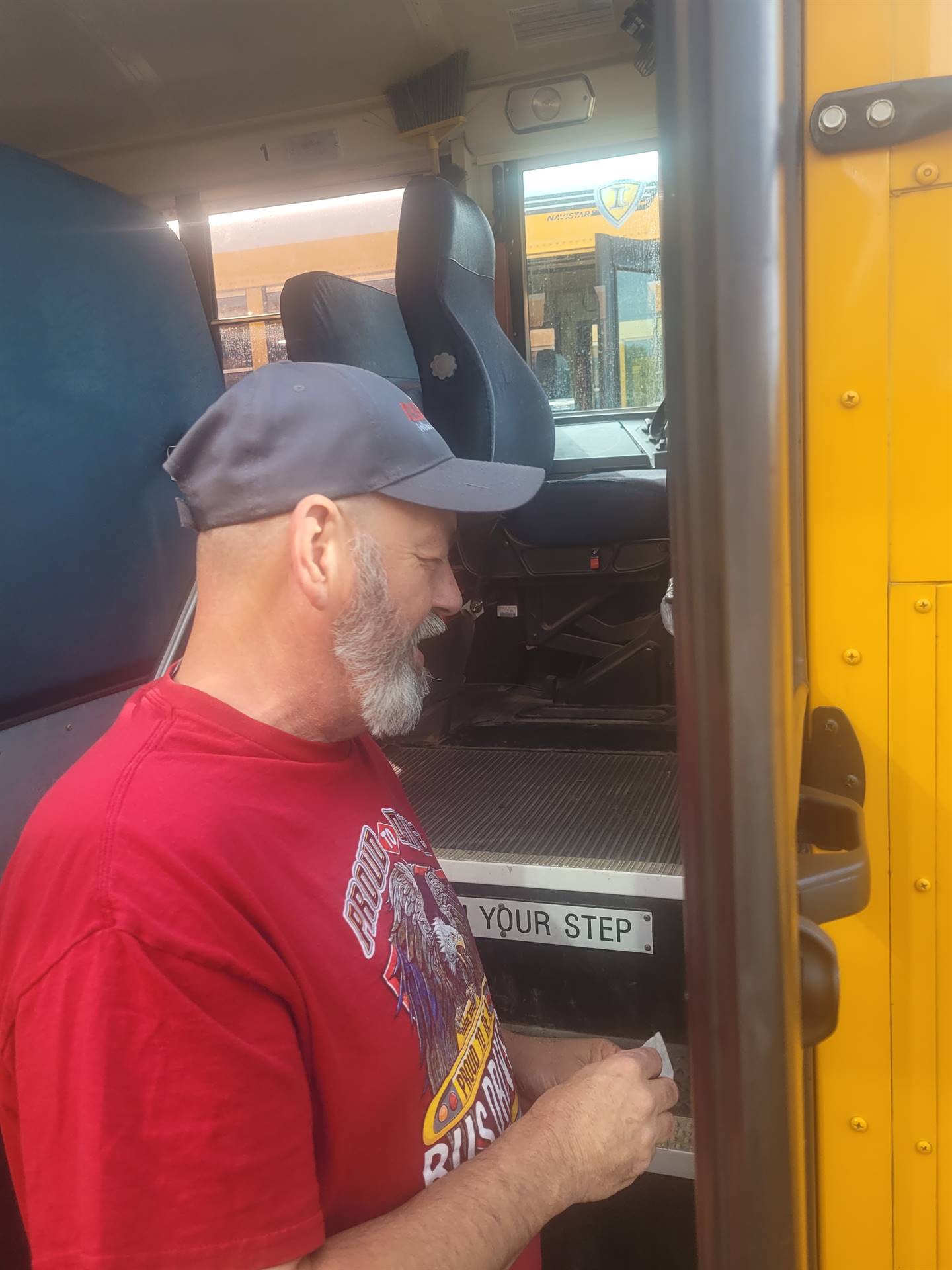 Bus driver cleaning door