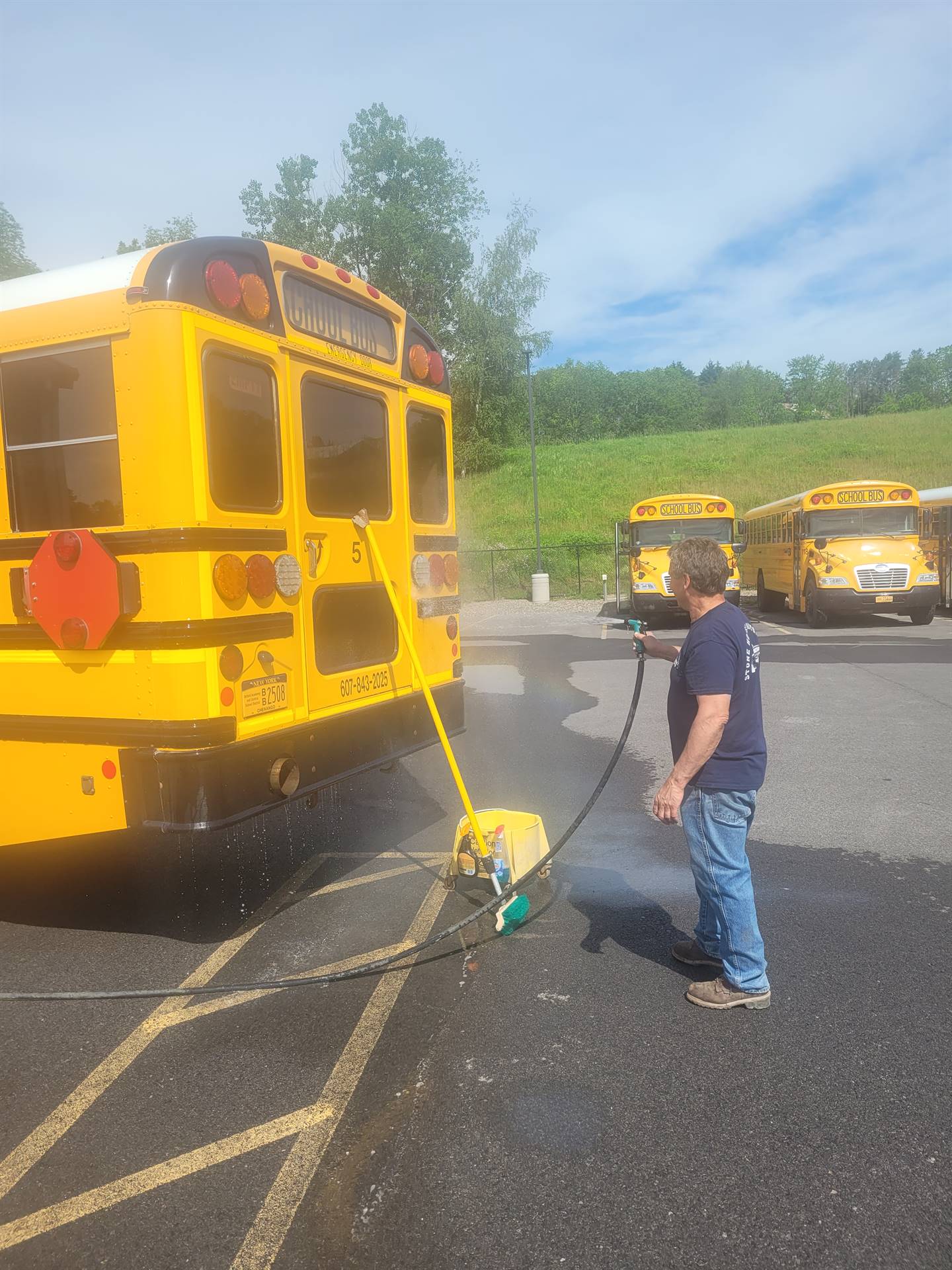 Bus Driver cleaning bus