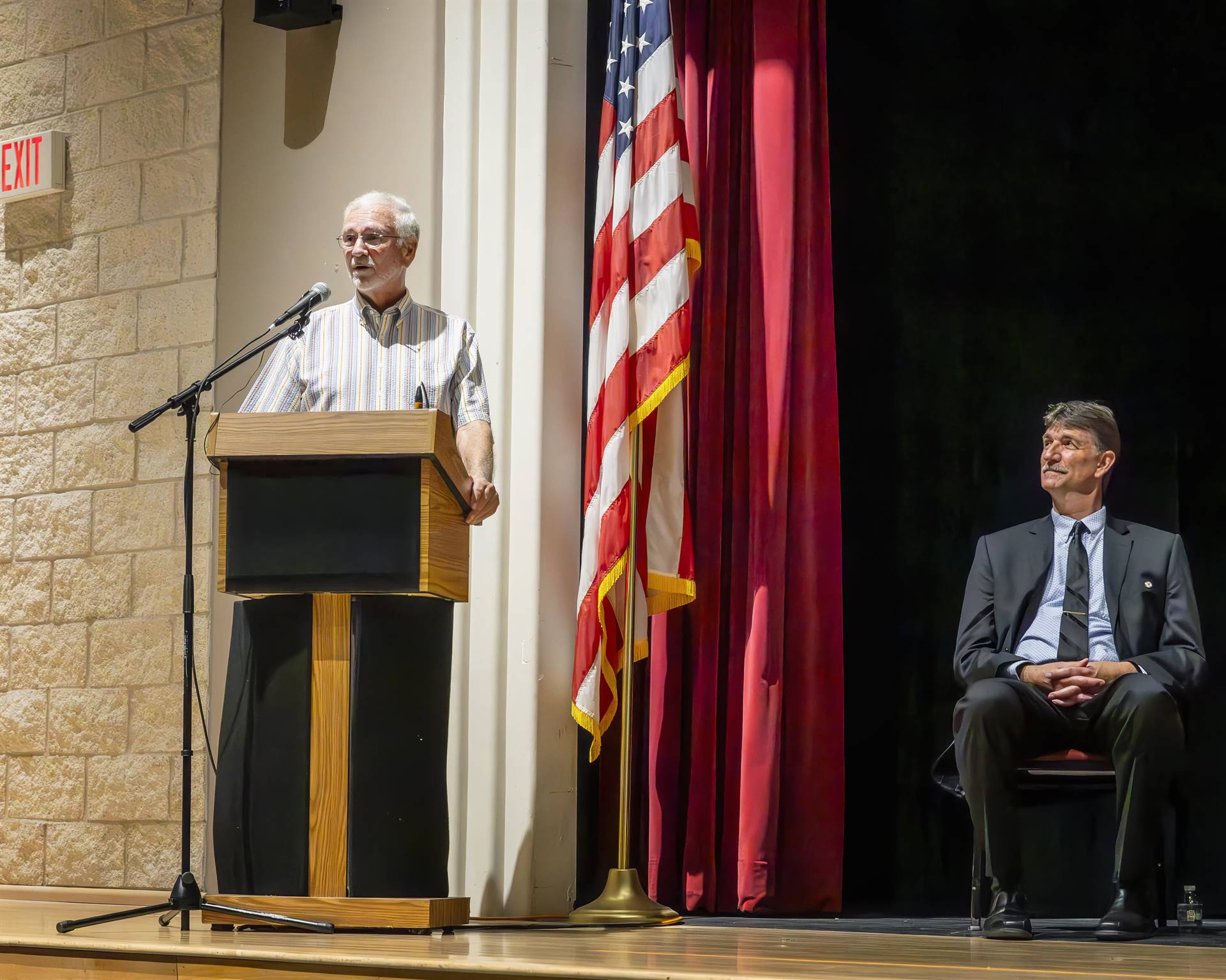 Mr. Bartle speaking at the podium