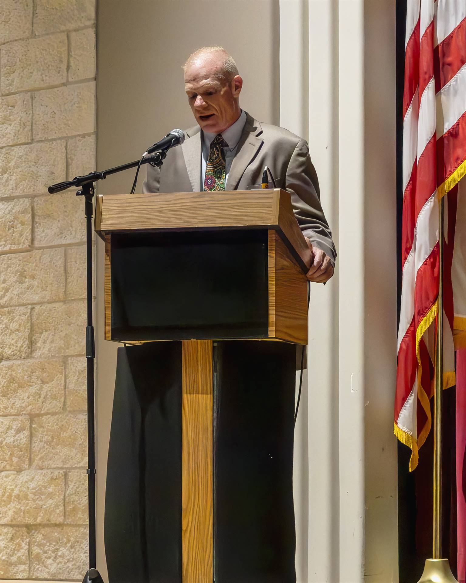 Superintendent speaking at podium