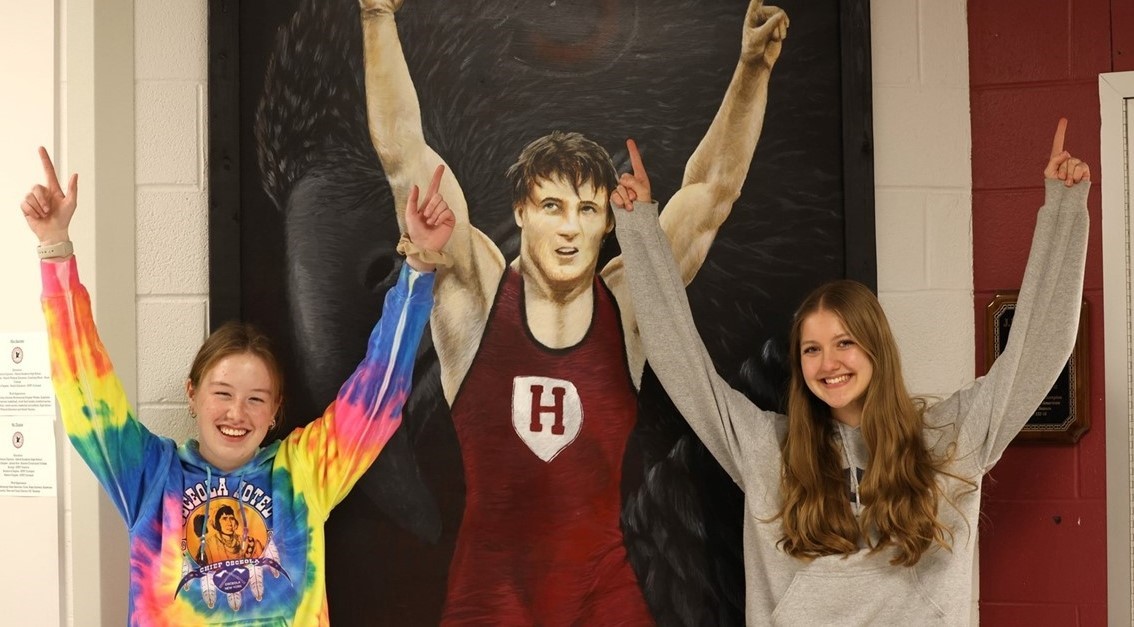 Clyde Cole wresting tourney - girls pointing number one fingers in the air