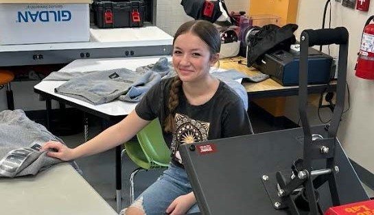 girl in fab lab making a t-shirt
